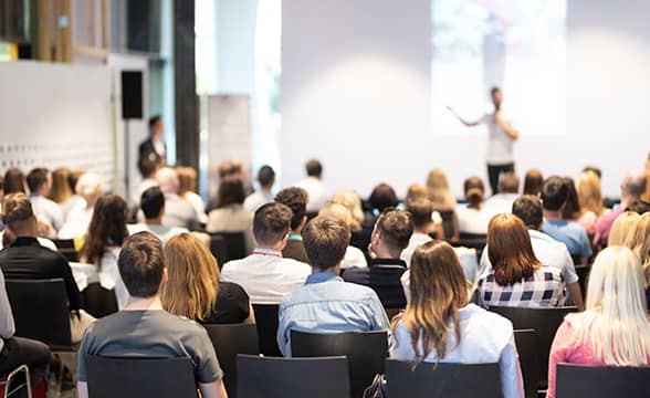 A person speaks at a convention