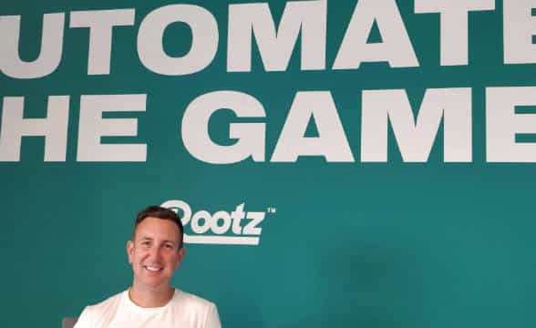 Sam Brown, Rootz's new CCO, against a company background.