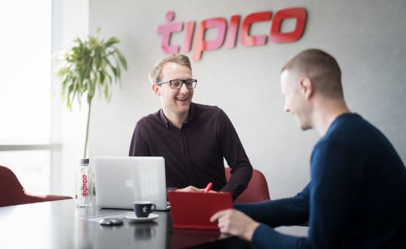 Tipico's office with people in it.