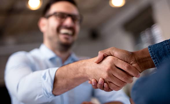 Two businessmen shake hands