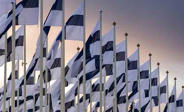 Several rows of Finnish flags