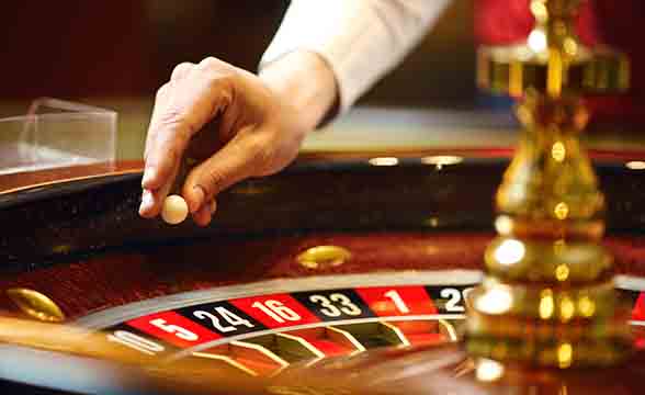 A croupier plays roulette