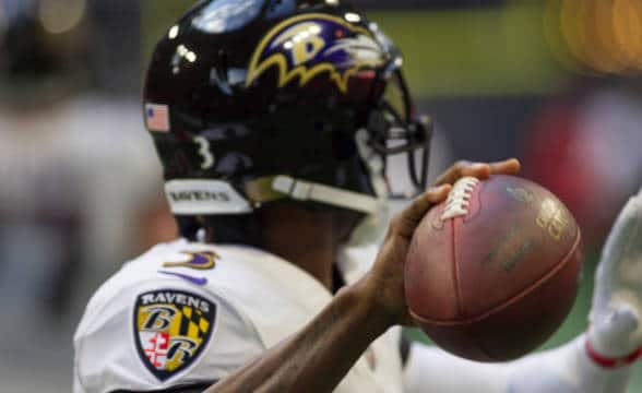 A Baltimore Ravens players preparing to take a pass.