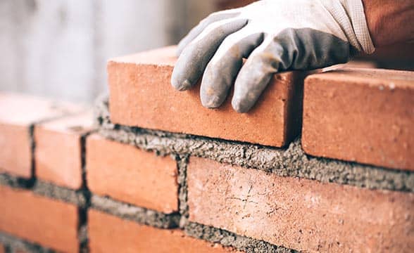 A builder works on a construction project