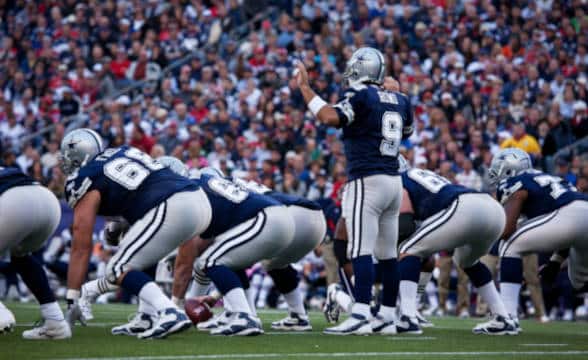 Dallas Cowboys' players in the NFL pitch.