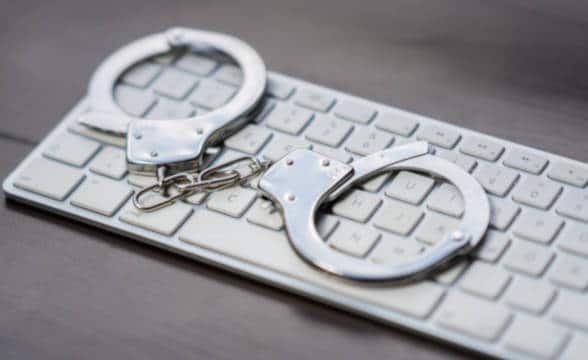 Handcuffs and keyboard image.