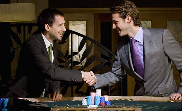 Two gambling enthusiasts shake hands