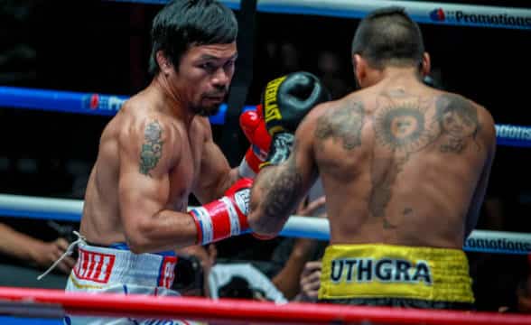 Manny Pacquiano boxing in the ring.