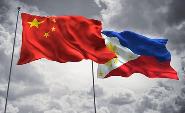 The Chinese flag next to the Philippines' flag