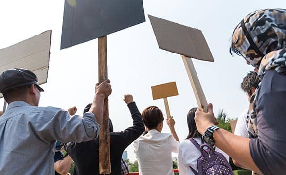 A crowd protests for a change