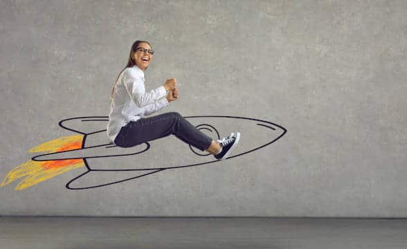 A woman sitting on a rocket to boost business.