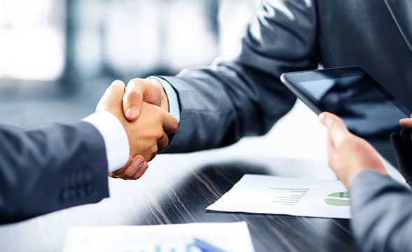 Two businessmen shake hands