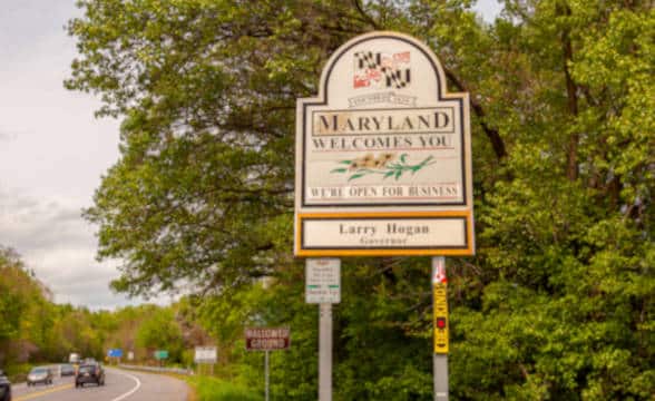 Road sign reading Maryland welcomes you