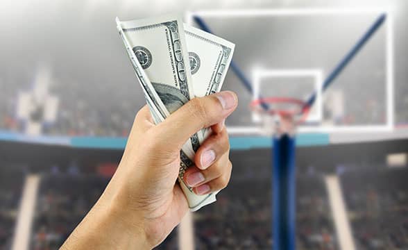 Wagering money on a professional basketball event