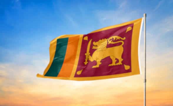 Sri Lanka flag on a pole waving in the air