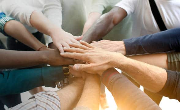 team-joining-their-hands