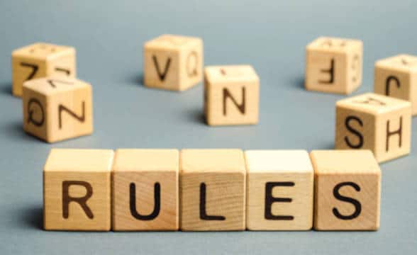 Wooden blocks spelling the word rules