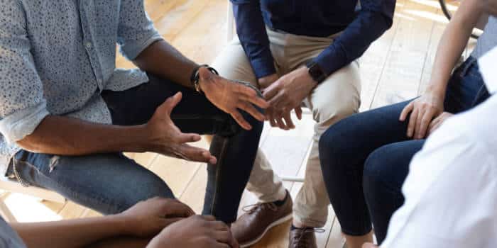 A group of people supporting each other.