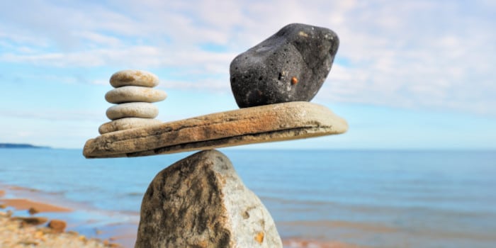 A scale made of rocks that are balanced