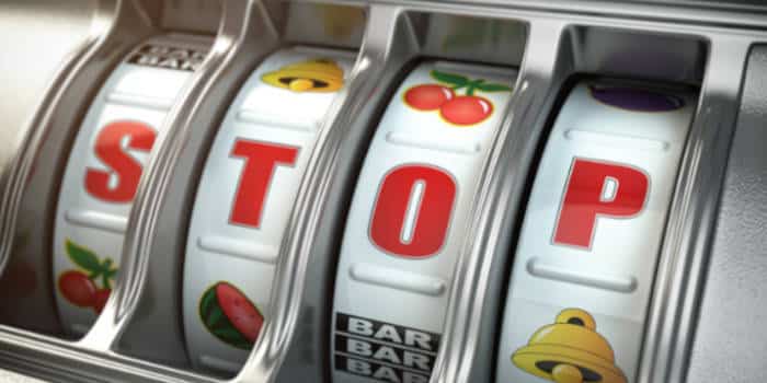 Slot machine with the word stop written on the reel