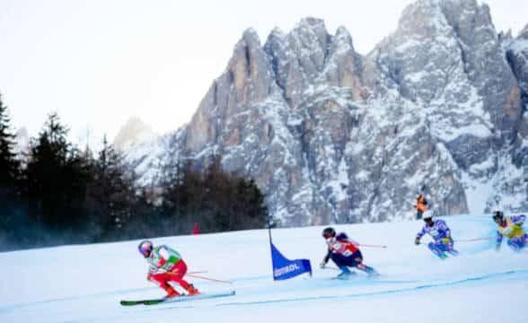 Skiers going down a mountain