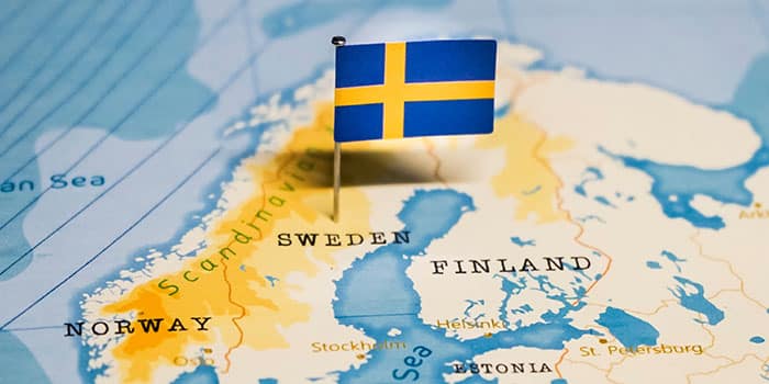 Sweden pinned with a flag on the map of Europe