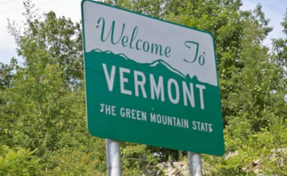 Road sign with text Welcome to Vermont