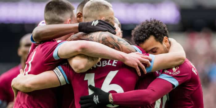 West Ham players embracing.