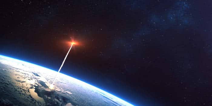 A rocket leaving Earth's orbit.