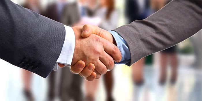 Two businessmen shake hands