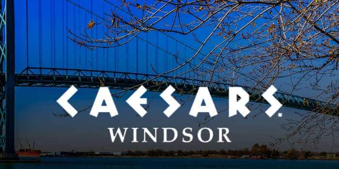 Caesars Windsor official logo with the Ambassador bridge in the background