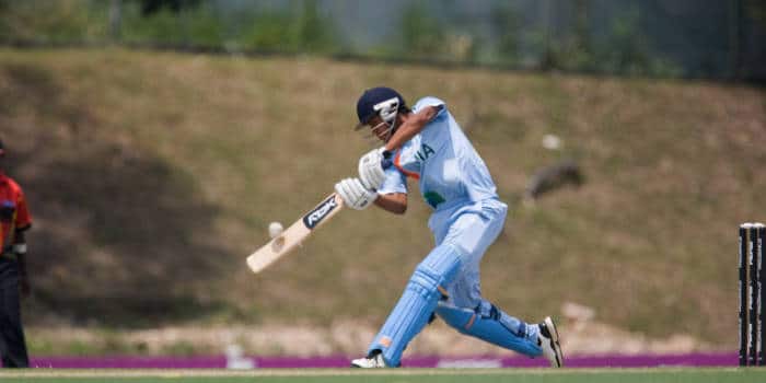 Cricket player taking a bat.