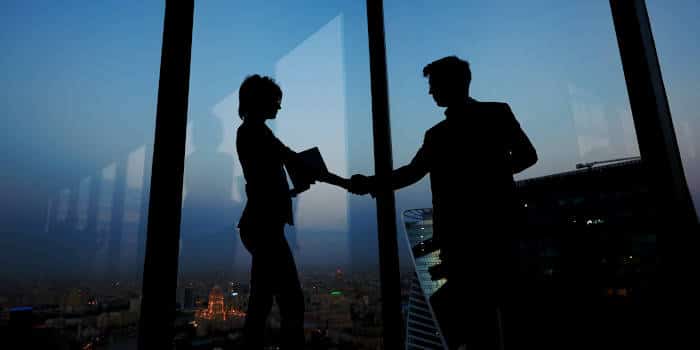 Two people shaking hands.