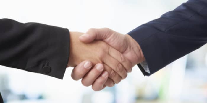 Close up photo of two businessmen shaking hands