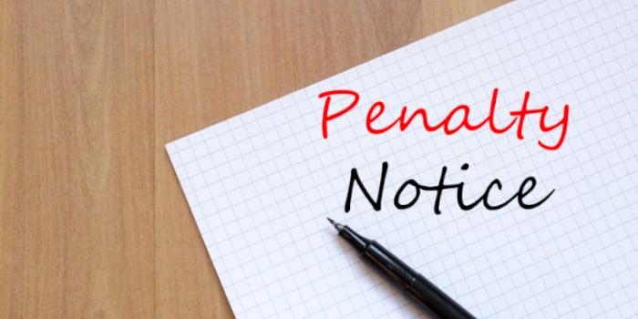 Penalty notice written on a notebook