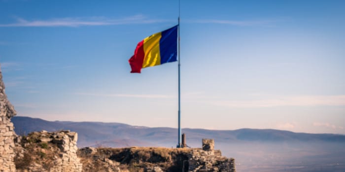 Romanian flag waving on a pole