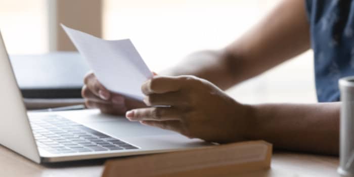 Close up shot of a woman holding document