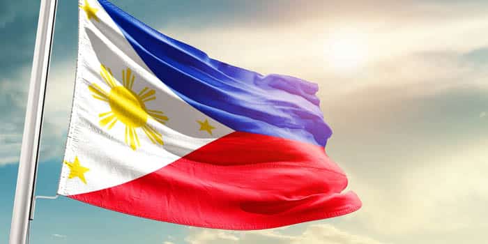 The Philippine flag on a cloudy sky