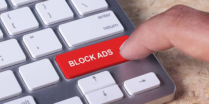 Person presses a button saying "block ads"