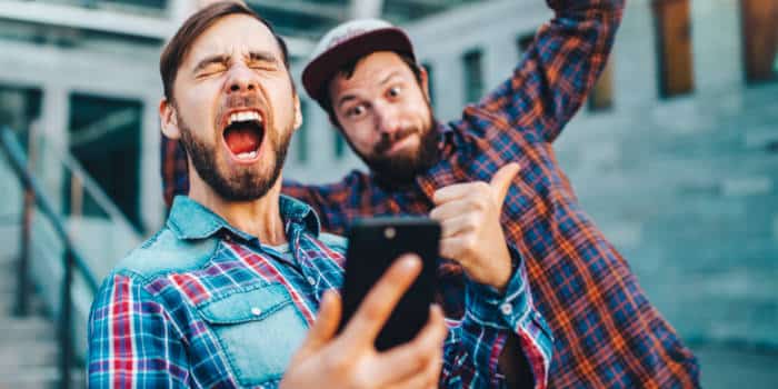 Two people cheering at a win.