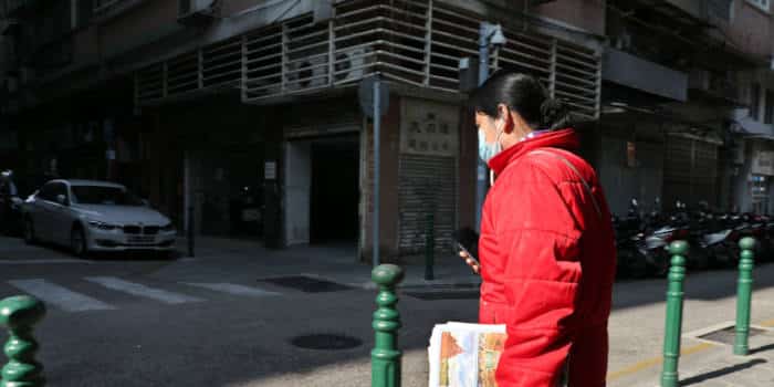 Macau woman wearing a mask in the street.