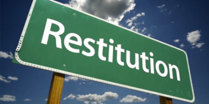 Restitution road sign