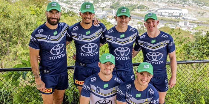 The North Queensland Toyota Cowboys wearing Tab-branded caps