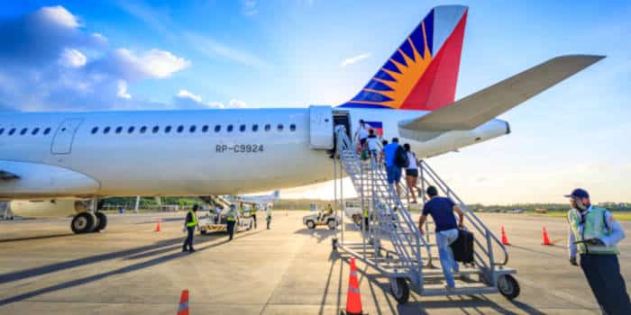 Philippines' airlines, plane and passengers boarding.