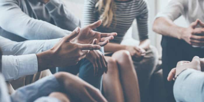 A group of people discussing something.