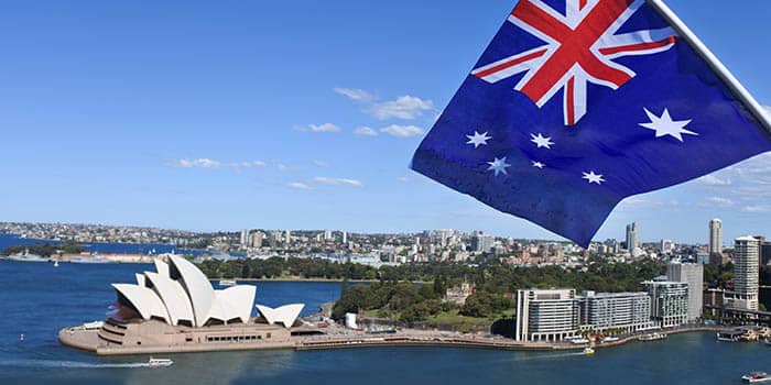 Australia's Sydney Opera House with a flag of Australia seen in the photo.