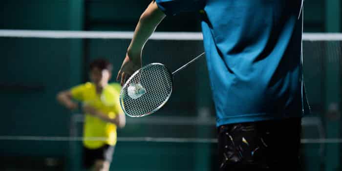 Badminton players play the game