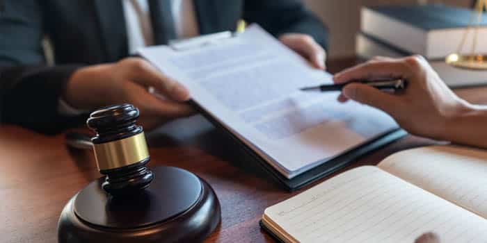 A judge discusses a case with an attorney