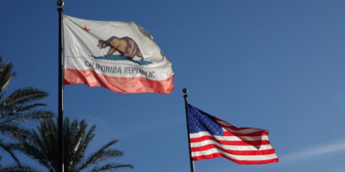 California flag and US flag waving in the air