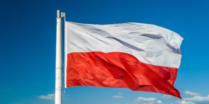 Polish flag on a pole waving in the air